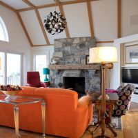 Stone Fireplace Orange Sofa