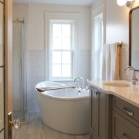 broken front bath vanity free-standing tub taupe white bathroom
