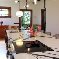 century home with modern lights and kitchen island