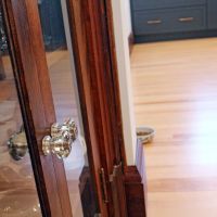 antique glass doors with blue kitchen cabinets